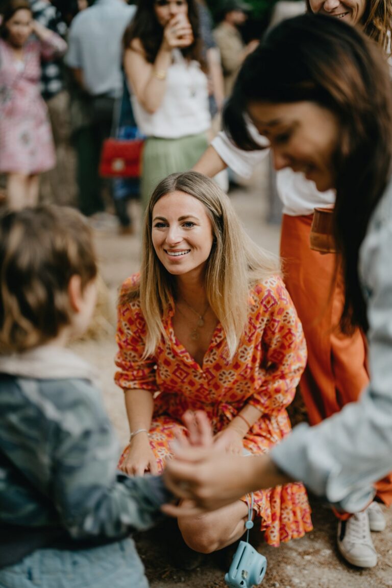 People talking at an outdoor gathering